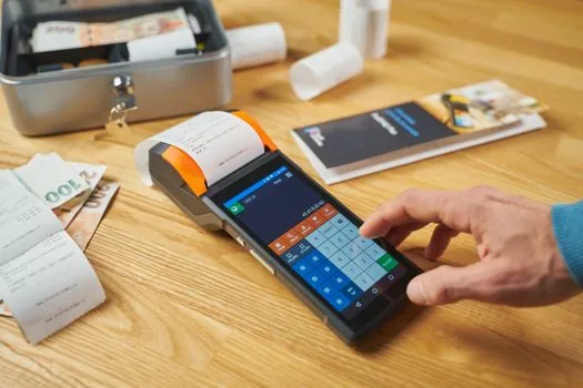 calculator, funeral expense receipt, and bank passbook on neutral table