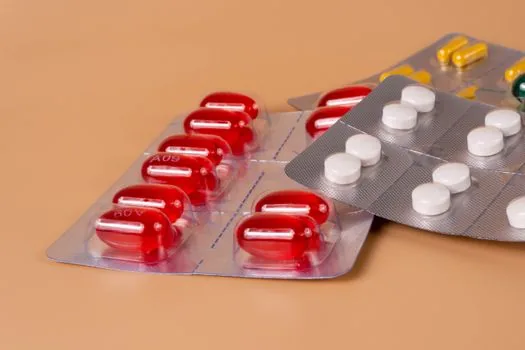 Korean adult child organizing diabetes prescription, registration application form and pharmacy receipts before insurance claim