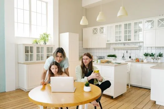 Senior parent and adult child checking vaccination history and resident registration date at kitchen table