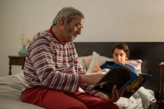 Senior parent and adult child comparing walker, safety rail and electric care bed rental estimate in a welfare equipment showroom