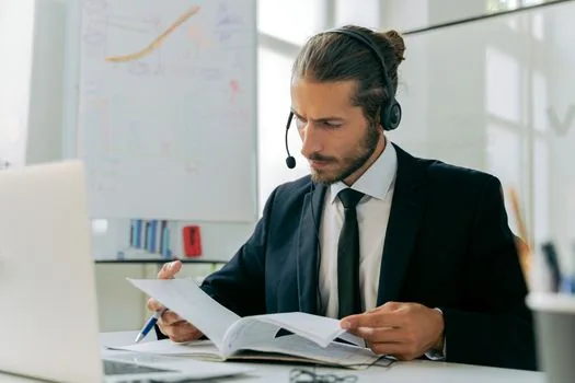 adult child calling local dementia care center while checking calendar and parent address documents, Korean home desk, realistic editorial photography, no text