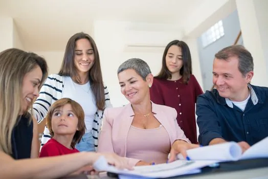 adult child organizing resident registration copy, income documents, and senior parent ID card for rental housing application | 주민센터 접수 전 주민등록과 소득 관련 서류를 정리하는 장면