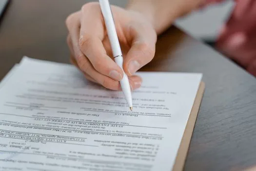 bankbook copy, family relation certificate and local government benefit application form on bright table, Korean welfare paperwork photo | 통장사본과 가족관계증명서, 신청서를 정리하는 장면