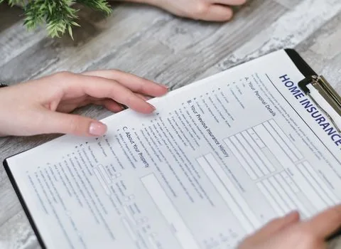 close view of Korean welfare documents and replacement card application checklist on home desk, adult child helping elderly parent, realistic editorial photography, no text