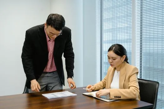 Dementia care center consultation scene with social worker checking guardianship eligibility checklist and family notes | 치매안심센터 상담자가 후견 필요 상황과 가족 메모를 확인하는 장면