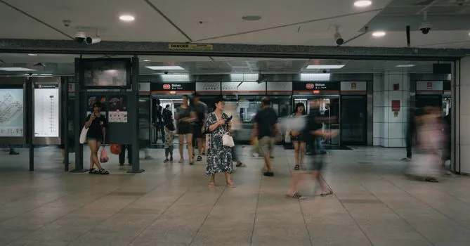 elderly Korean parent touching senior transit card at subway gate while adult child checks route map, realistic public transport photo | 우대용 교통카드로 도시철도 개찰구를 이용하는 장면