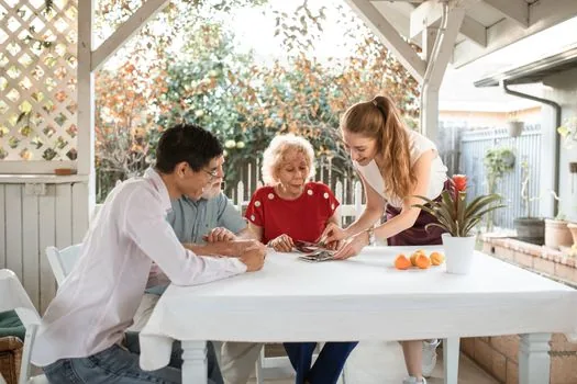 Korean adult child organizing parent care notes hospital admission paper and ID card on dining table, realistic warm home scene