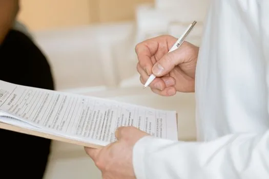 Korean family member arranging dementia diagnosis paper, ID copy and welfare consultation memo before visiting dementia care center | 치매안심센터 상담 전 가족이 진단서와 신분증, 상담 메모를 정리하는 장면