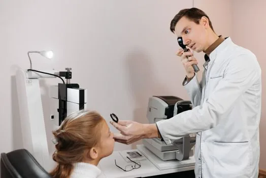Korean ophthalmology surgery estimate with highlighted excluded costs, adult child calling public health center, realistic senior benefit guide photo | 눈 수술 견적서에서 지원 제외 항목을 보건소에 확인하는 장면