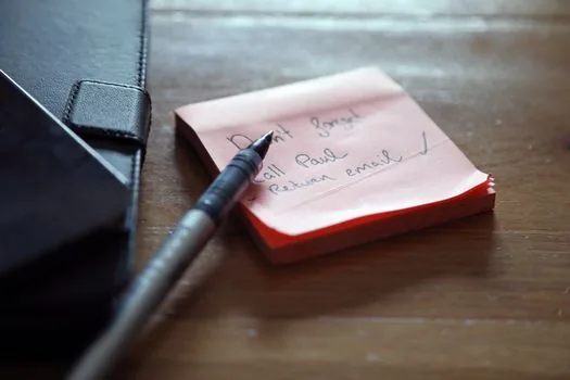 smartphone welfare help request form with location pin concept beside handwritten parent care checklist, Korean home table, realistic editorial photo, no readable text
